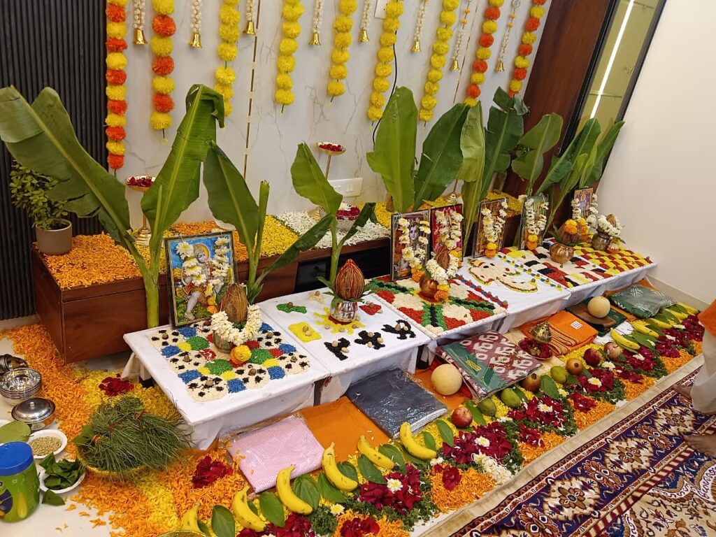 Navgraha and Vastu anushthan setup with banana plants, grain mandalas and marigold