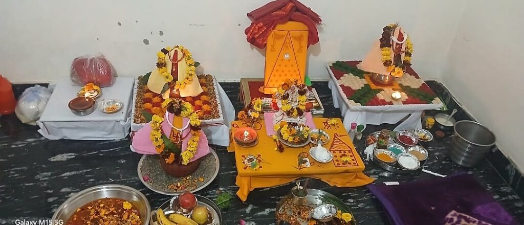 Multiple puja chowkis with yantra, marigold and samagri prepared for a large anushthan