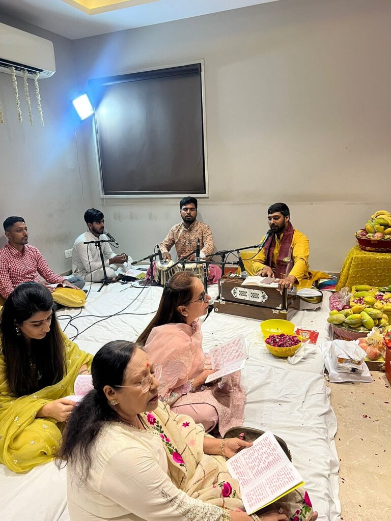 Acharyas of the Sunderkand Path mandali on harmonium and dholak during a sangeetmay path in Delhi NCR